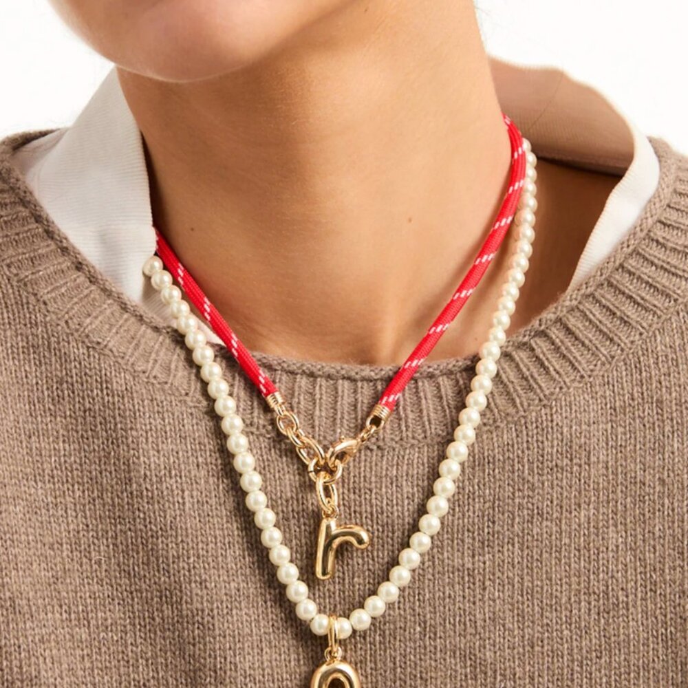 Roxanne Assoulin Layered Red Rope and Pearl Necklace with Gold Charms